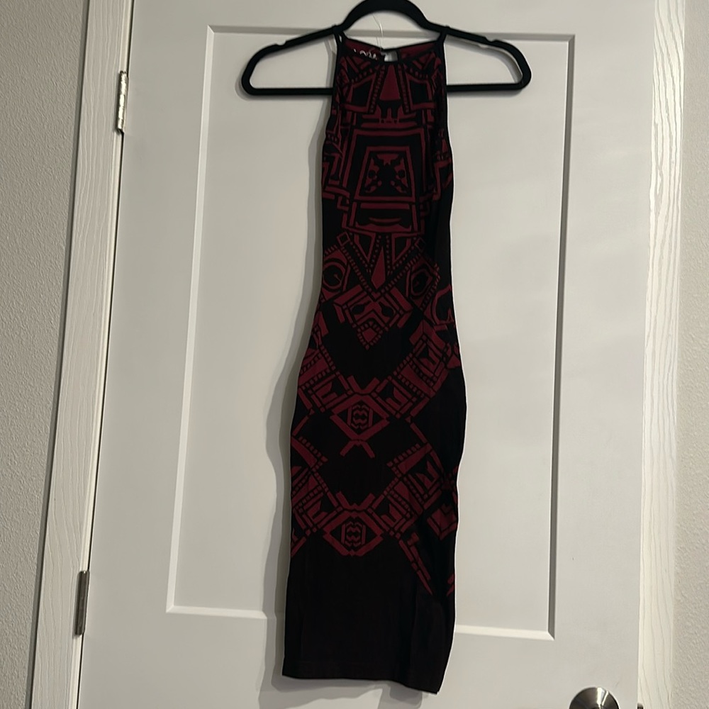 Women’s figure hugging black/maroon dress